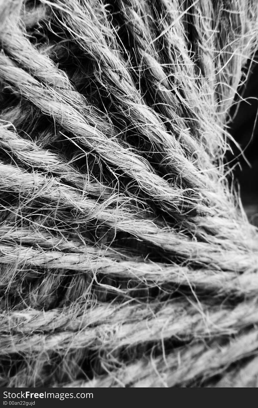 A ball of twine on a white background and close ups in Macro