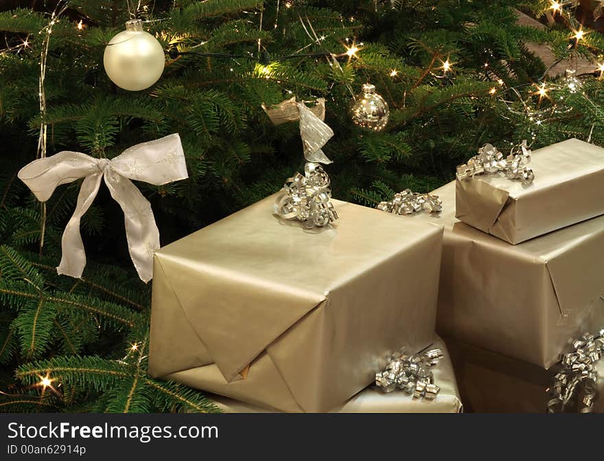 Gifts by the Christmas Tree. Gifts by the Christmas Tree