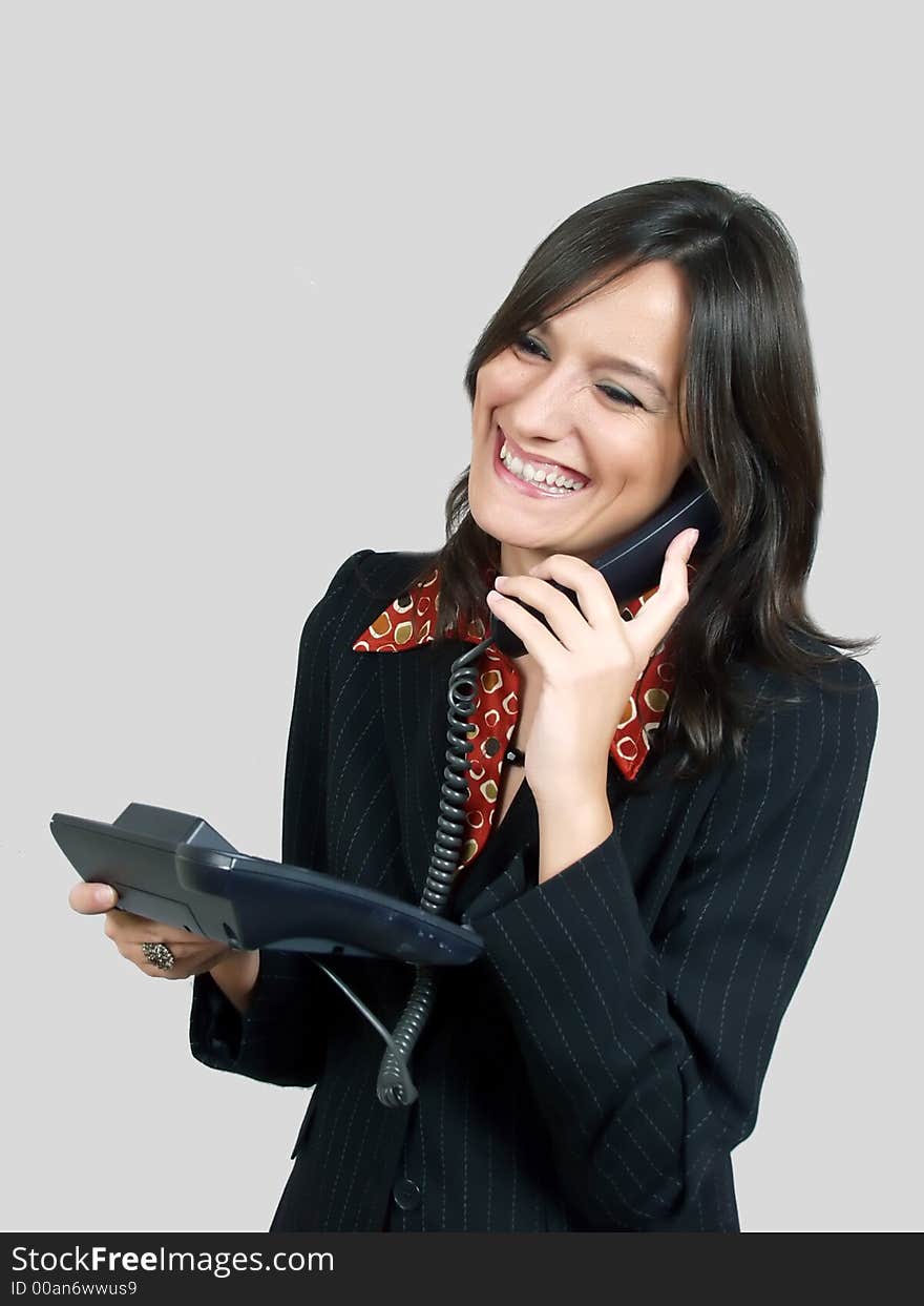 Beautiful woman talking at phone and smiling