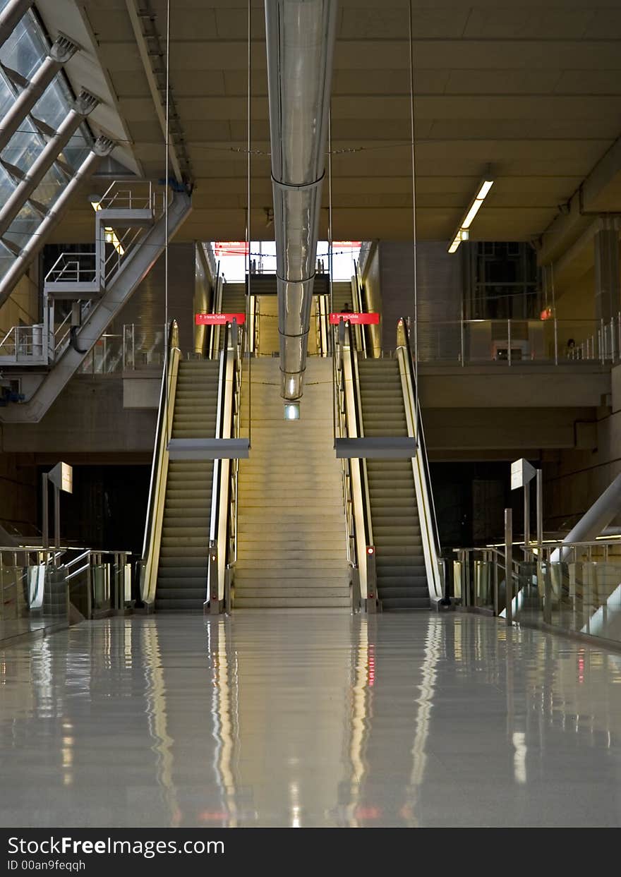 Escalators at a nearly empty urban metro station