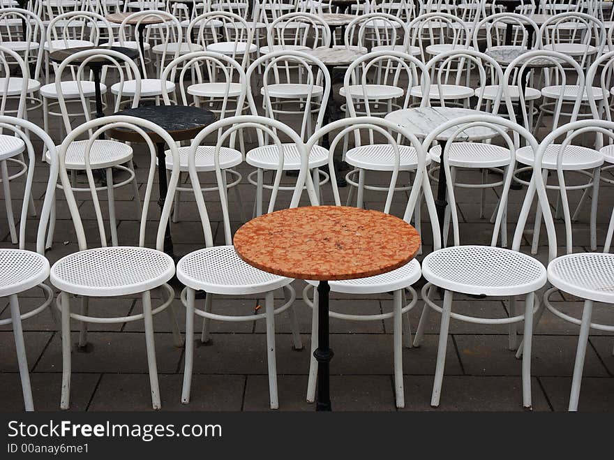 Shot in munich, germany, on a cold and windy day in November - but the owner of the cafe was optimistic and placed the chairs outside anyway. Shot in munich, germany, on a cold and windy day in November - but the owner of the cafe was optimistic and placed the chairs outside anyway