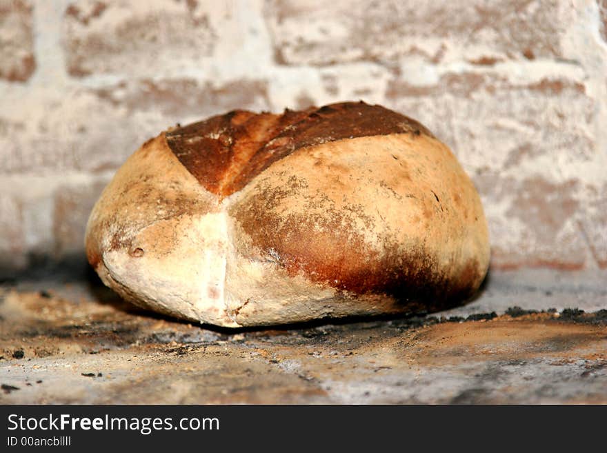 Loaf of freshly made bread inside the oven