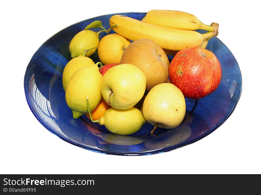 Blue bowl with various fruits inside isolated over white