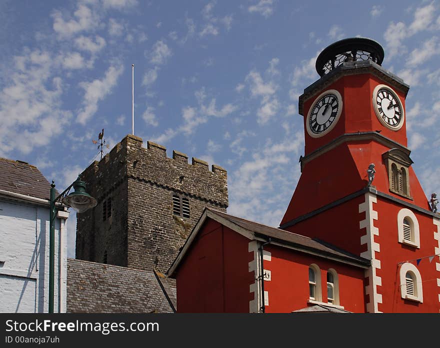 A red house and an old church sit next to each other in a small town in south-west Wales. A red house and an old church sit next to each other in a small town in south-west Wales.