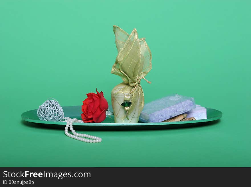 Spa items and red rose on green chroma key background. Spa items and red rose on green chroma key background