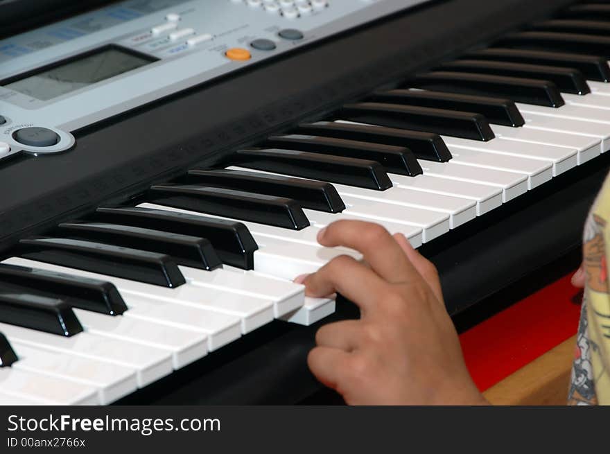 Close up shot of hands playing the piano