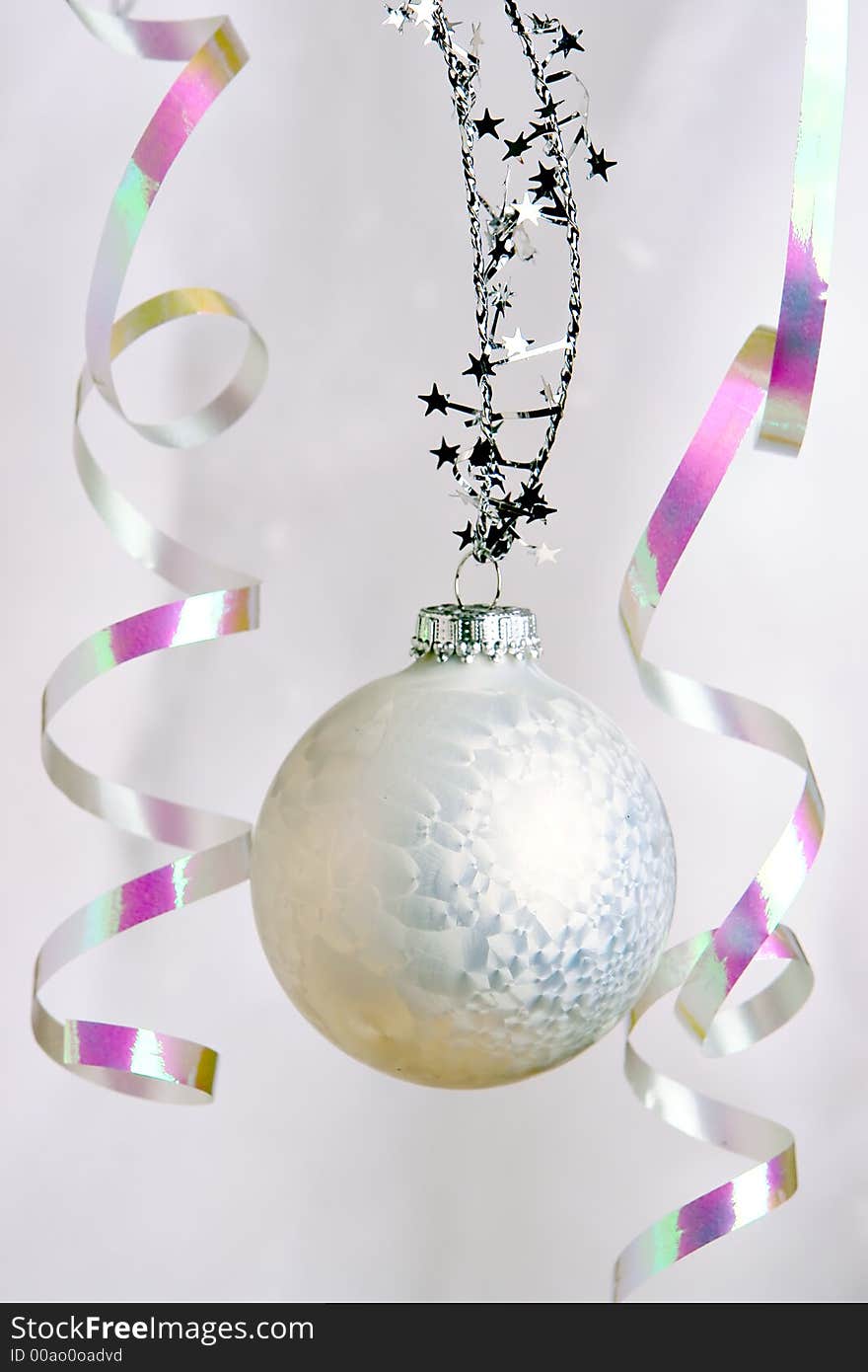 A single white christmas ball ornament. A single white christmas ball ornament