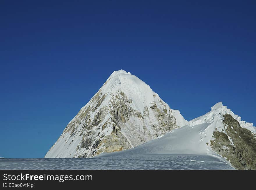 Snowcowered high cordillera mountain and clouds. Snowcowered high cordillera mountain and clouds