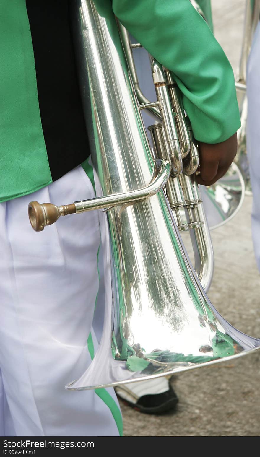 Close-up of a boy holding a trombone. Close-up of a boy holding a trombone