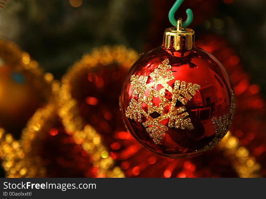 Red glass ball on the Christmas tree, interesting design. Red glass ball on the Christmas tree, interesting design.