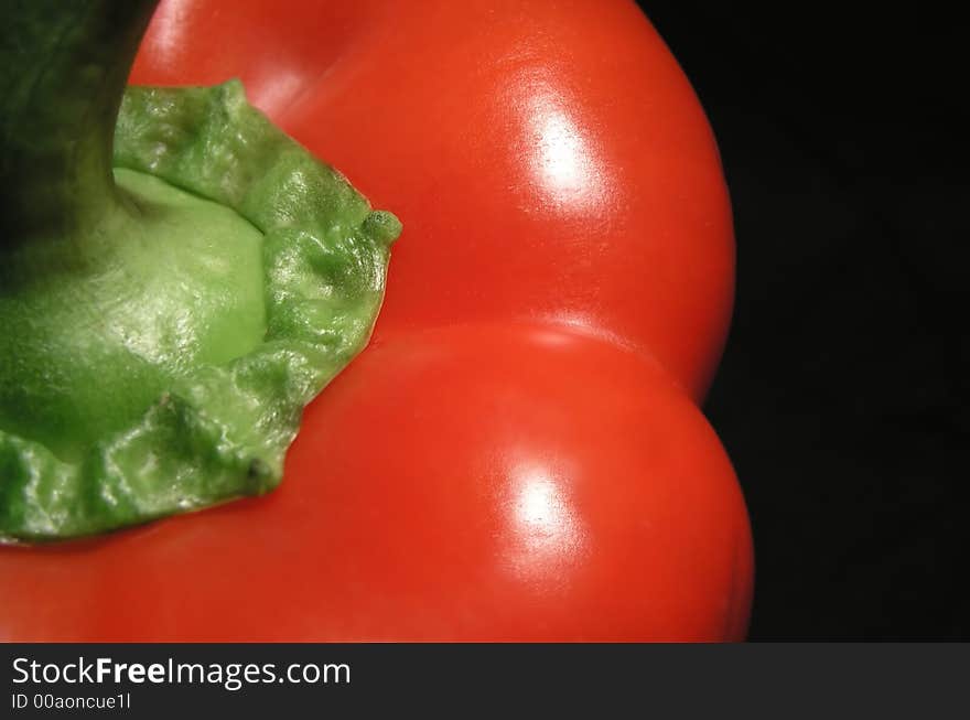 Red pepper on black background