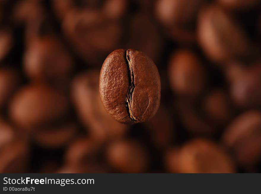 Coffee-bean above coffee grains, horizontal. Coffee-bean above coffee grains, horizontal