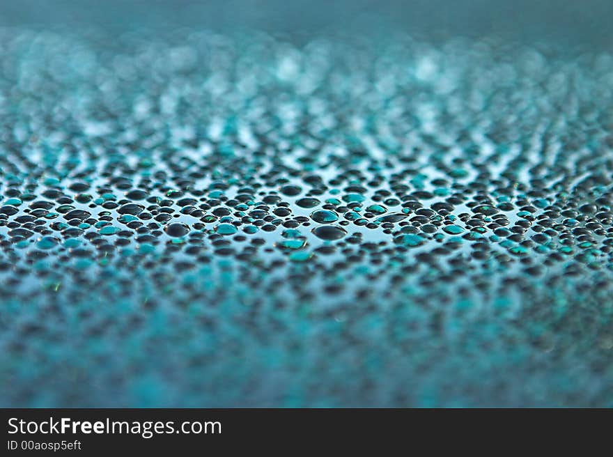 Water droplets on glass - narrow depth of field. Water droplets on glass - narrow depth of field