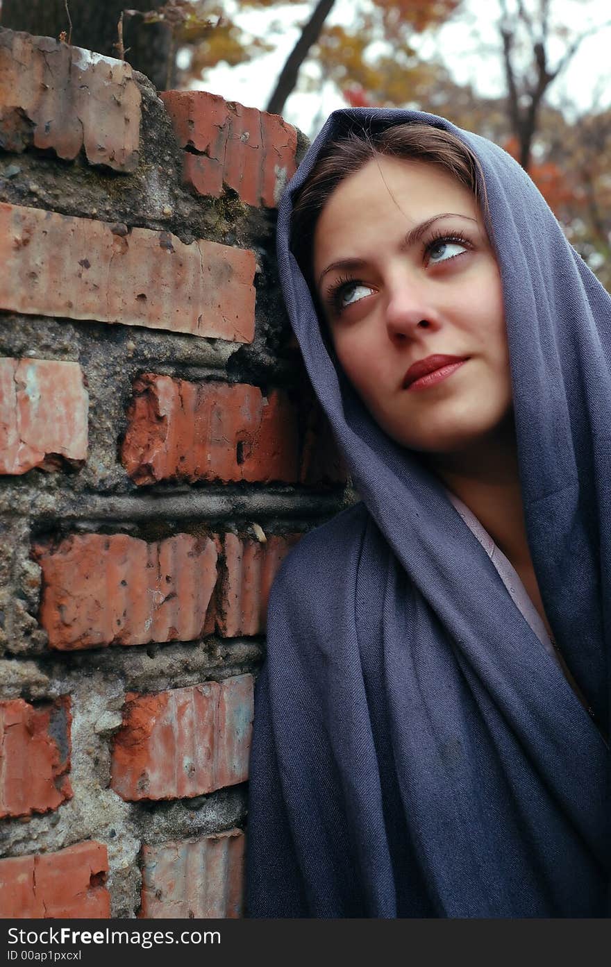 Yung woman near the brick wall. Yung woman near the brick wall.