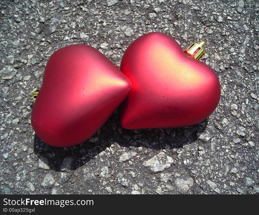 Closeup of two loving hearts made of christmas decoration symbolising love and romance