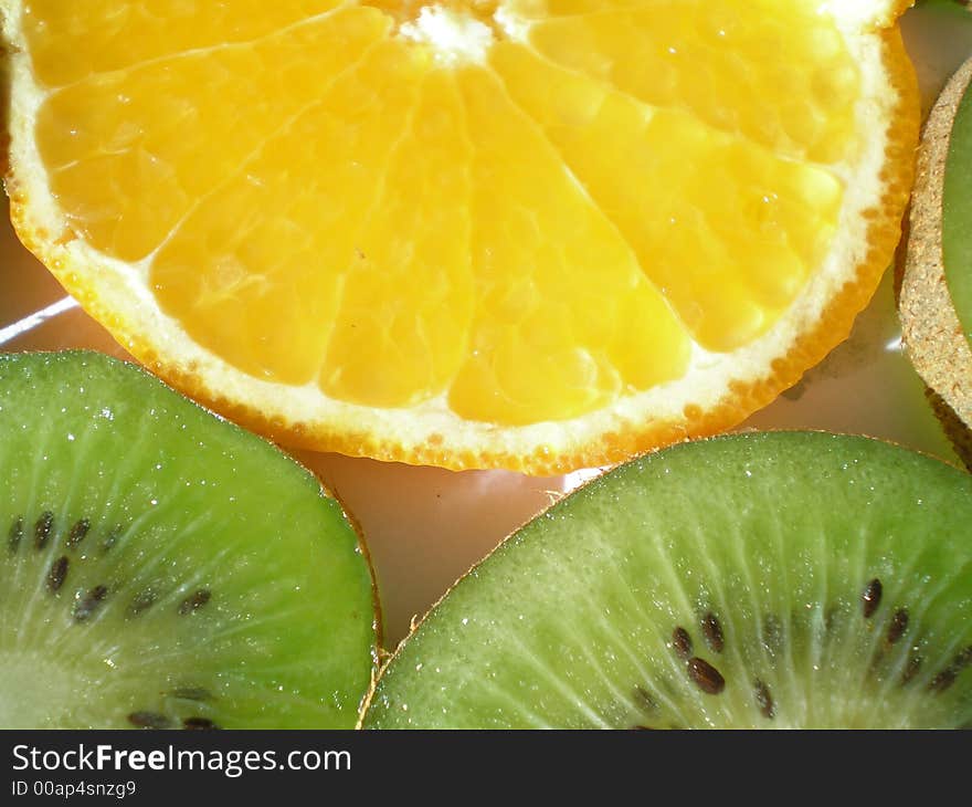 Close-up of pieces of kiwi and orange