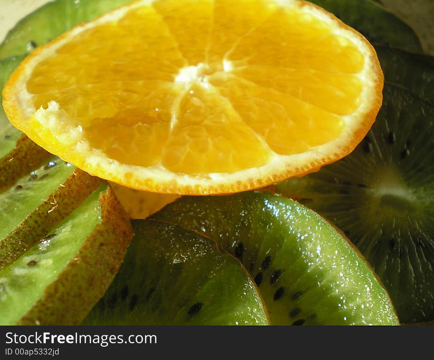 Close-up of kiwi and orange pieces