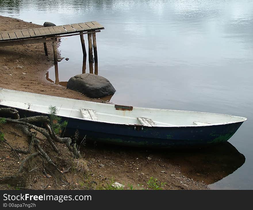 On coast of lake boats, water