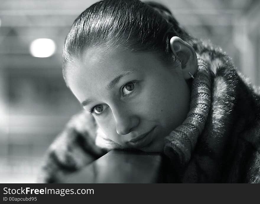 The young girl with a gentle smile close-up. b/w+blue tone. The young girl with a gentle smile close-up. b/w+blue tone