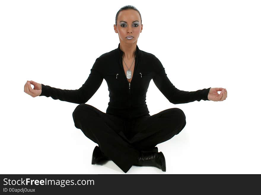 Bulgarian woman sitting on floor and meditating in finger touching lotus position. Bulgarian woman sitting on floor and meditating in finger touching lotus position.