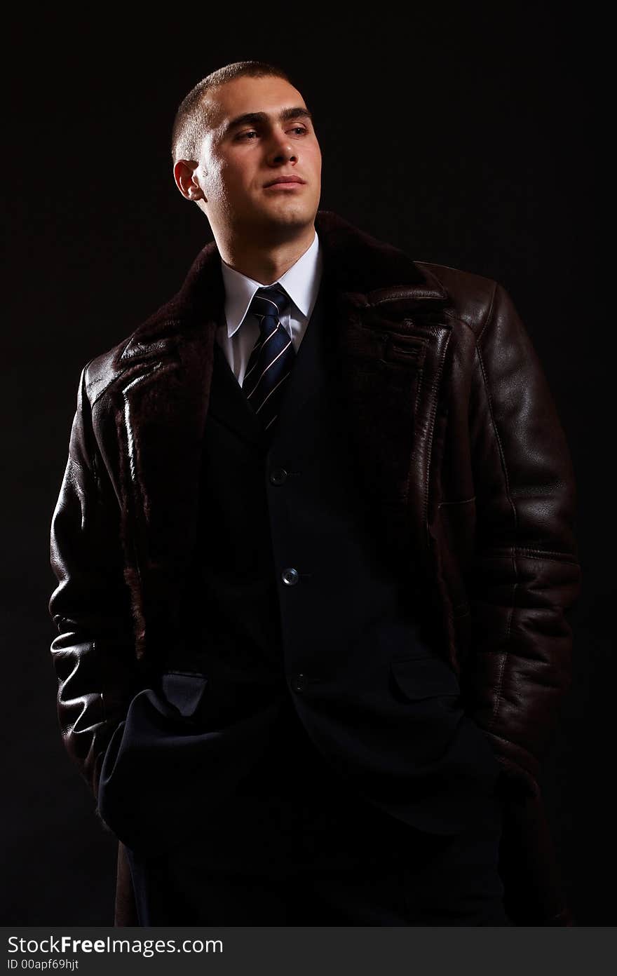 Young Modern Businessman portrait shot in studio over black background