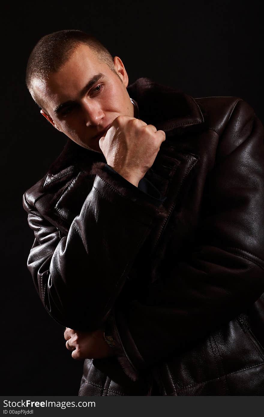 Young Modern Businessman portrait shot in studio over black background