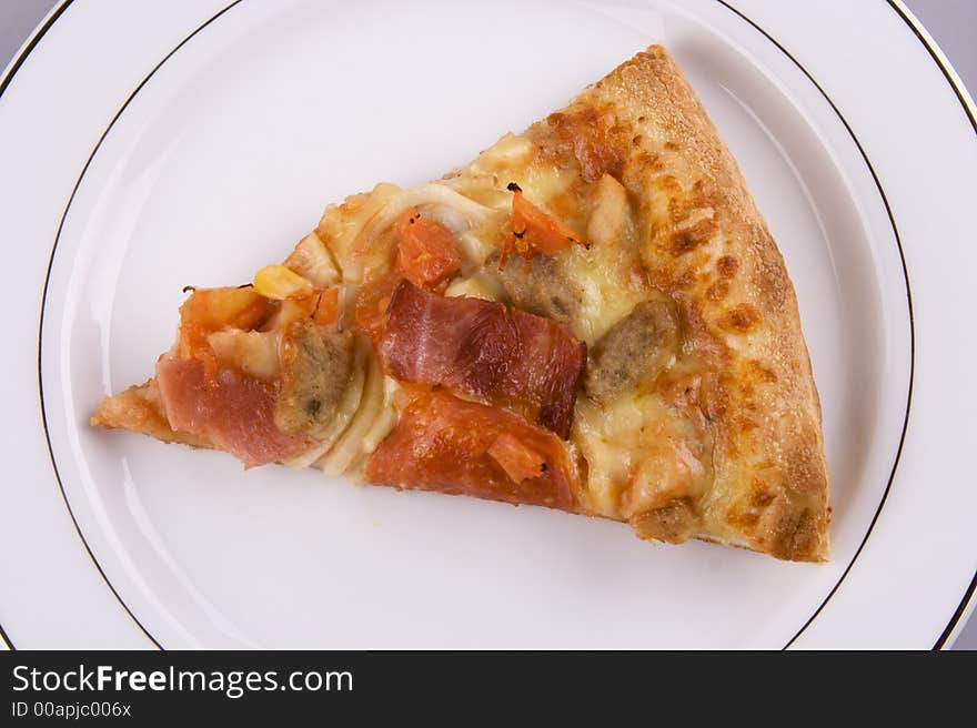 Close up of a pizza on a plate.