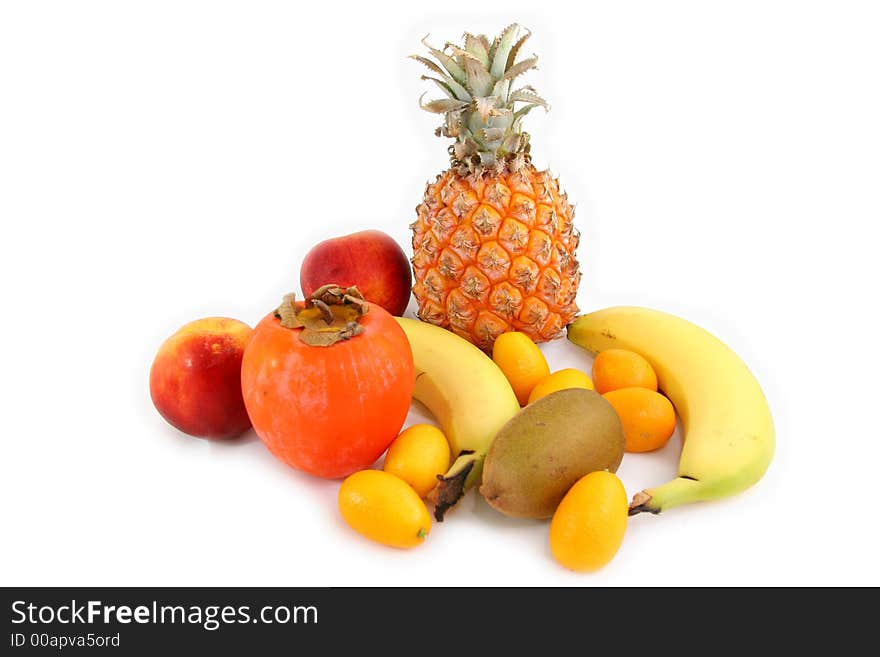 Several tropical fruits arranged over a white beackground