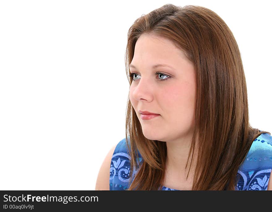 Profile of beautiful young woman with brown hair and bright blue eyes. Profile of beautiful young woman with brown hair and bright blue eyes.