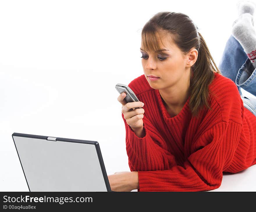 Young pretty women on white couch relaxing and using laptop computer. Young pretty women on white couch relaxing and using laptop computer