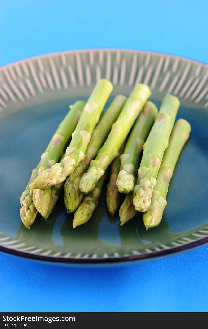 Fresh asparagus shoots on a plate