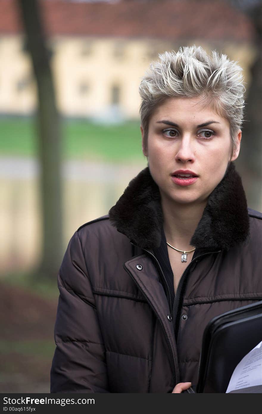 Portrait of a business woman outdoor in a park with various expressions. Portrait of a business woman outdoor in a park with various expressions