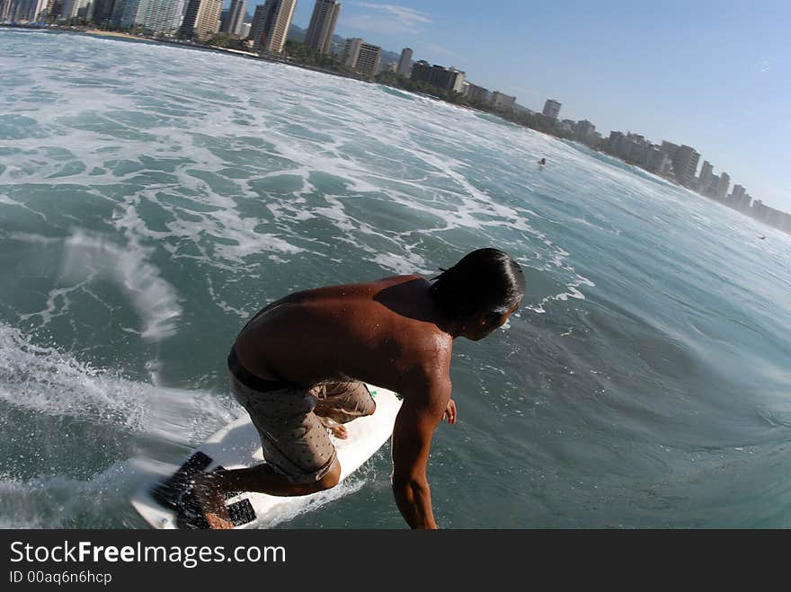 A surfer surfing down the line