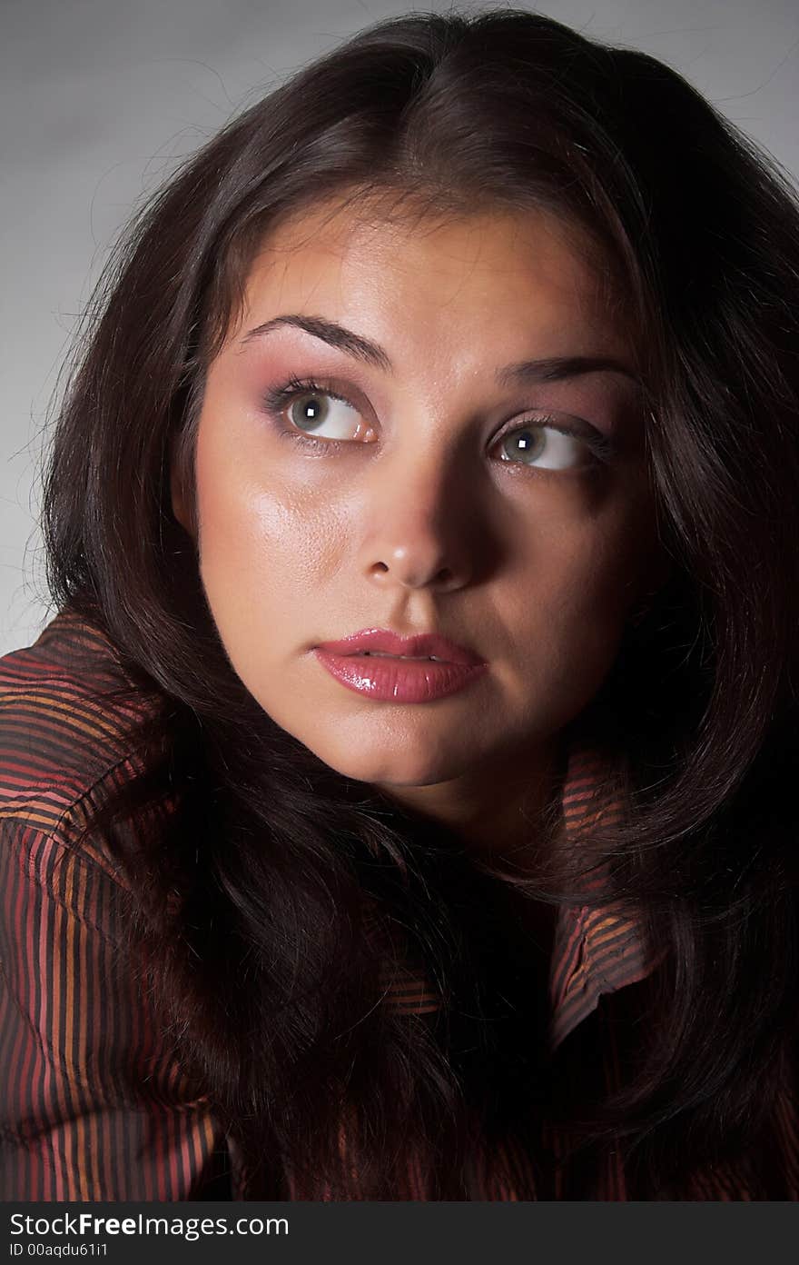 Closeup portrait of friendly  brunette