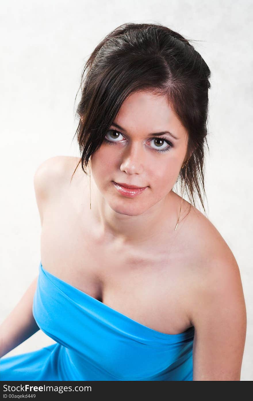 Beautiful young brunette woman in blue dress. Beautiful young brunette woman in blue dress