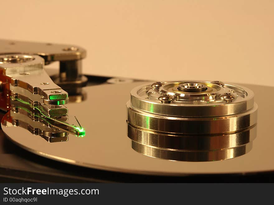 Internals of a hard disk, under green laser light. Internals of a hard disk, under green laser light.