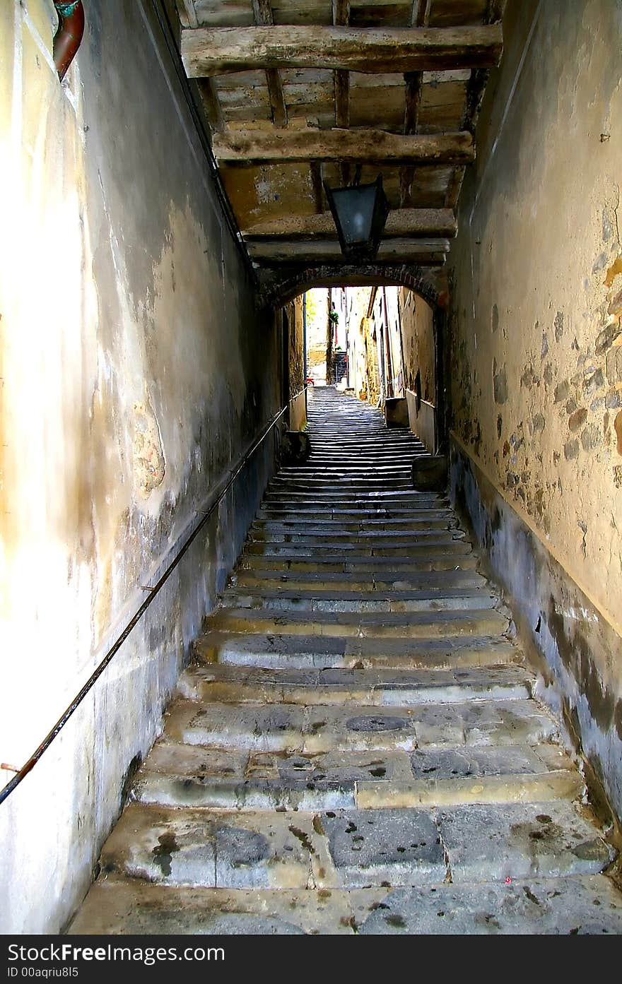 Little  covered street iwith stairs in Tuscany. Little  covered street iwith stairs in Tuscany