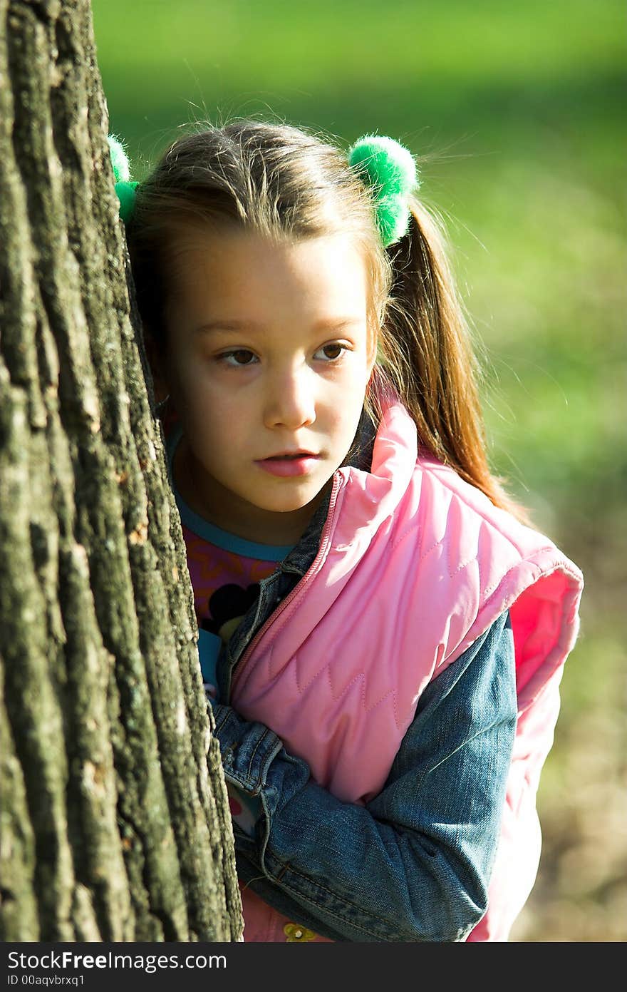 Portrait of little pretty girl in the park