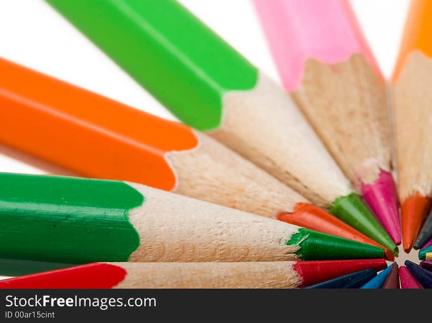 Thick colored pencils against a white background color