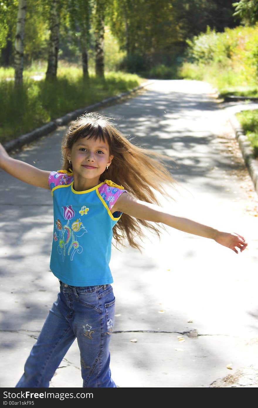 The dancing joyful girl with a long hair