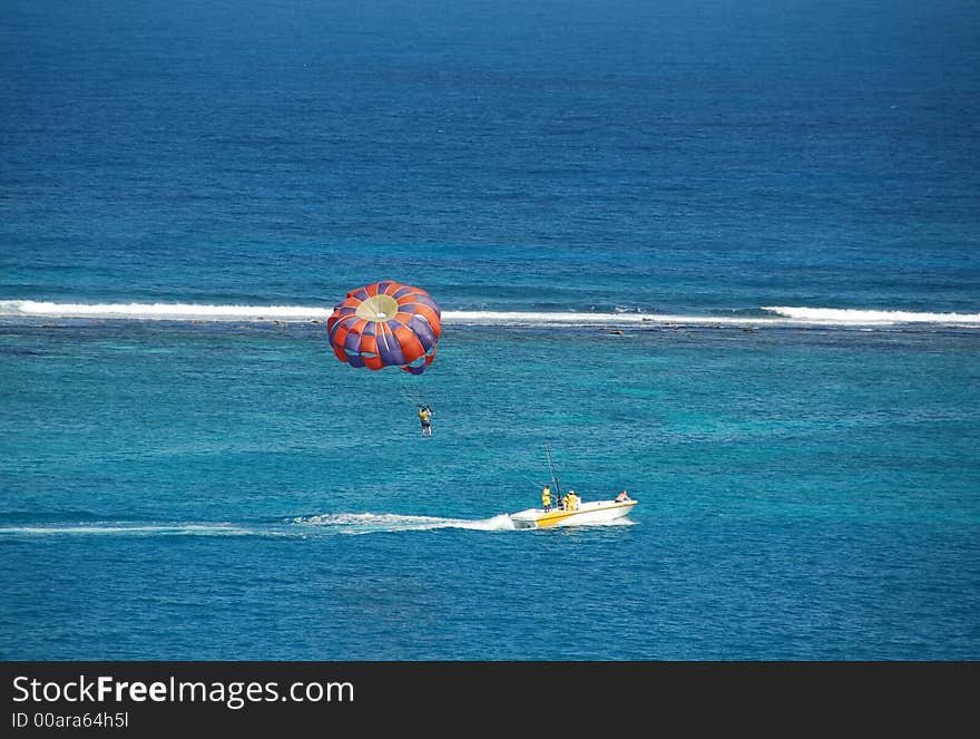 Parasailing activities at Caribbean island resort. Parasailing activities at Caribbean island resort