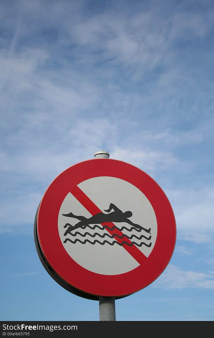 Prohibitory sign against blue sky