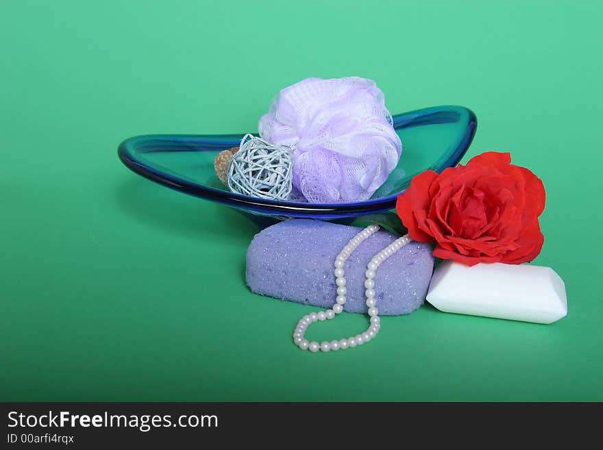 Sponge, soap and red rose on green chroma key background. Sponge, soap and red rose on green chroma key background