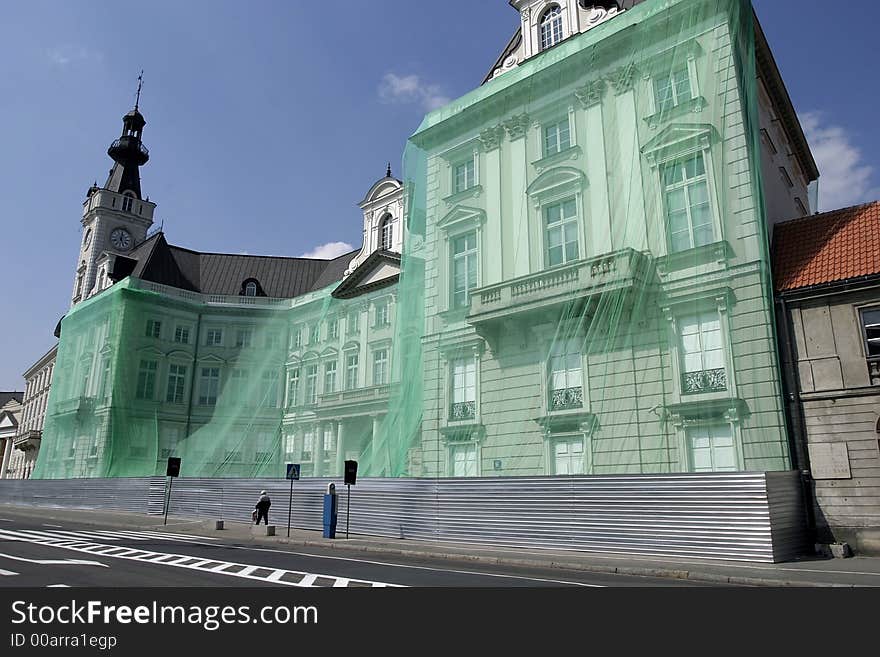 City hall in Warsaw covered with a green net during alterglobalists demonstration