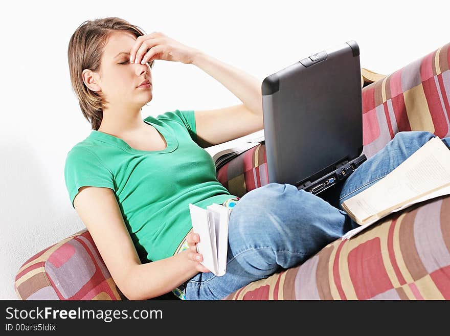 Young student at a desk preparing for an exam-on sofa