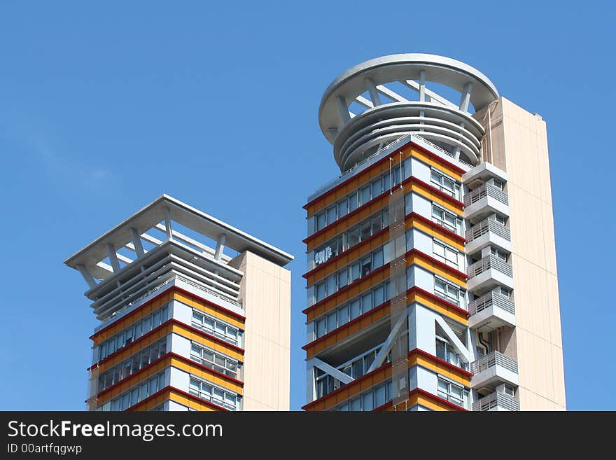 Two modern towers on blue sky background. Two modern towers on blue sky background