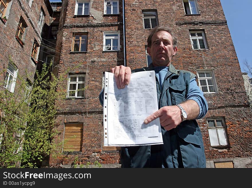 Man in front of ruined tenement-house in Warsaw, Poland. Man in front of ruined tenement-house in Warsaw, Poland