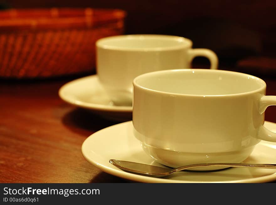 Two tea-cups and handmade basket. Two tea-cups and handmade basket