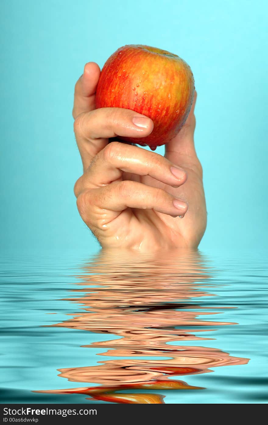 Closeup Of Man Holding Fresh wet Apple. Closeup Of Man Holding Fresh wet Apple