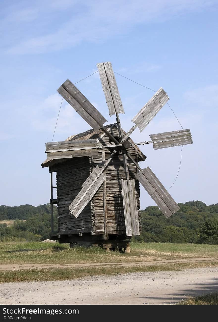 Big windmill on green field in Pirogovo, Kiev